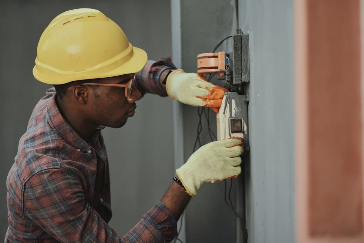 Technician recording a reading on the factory floor